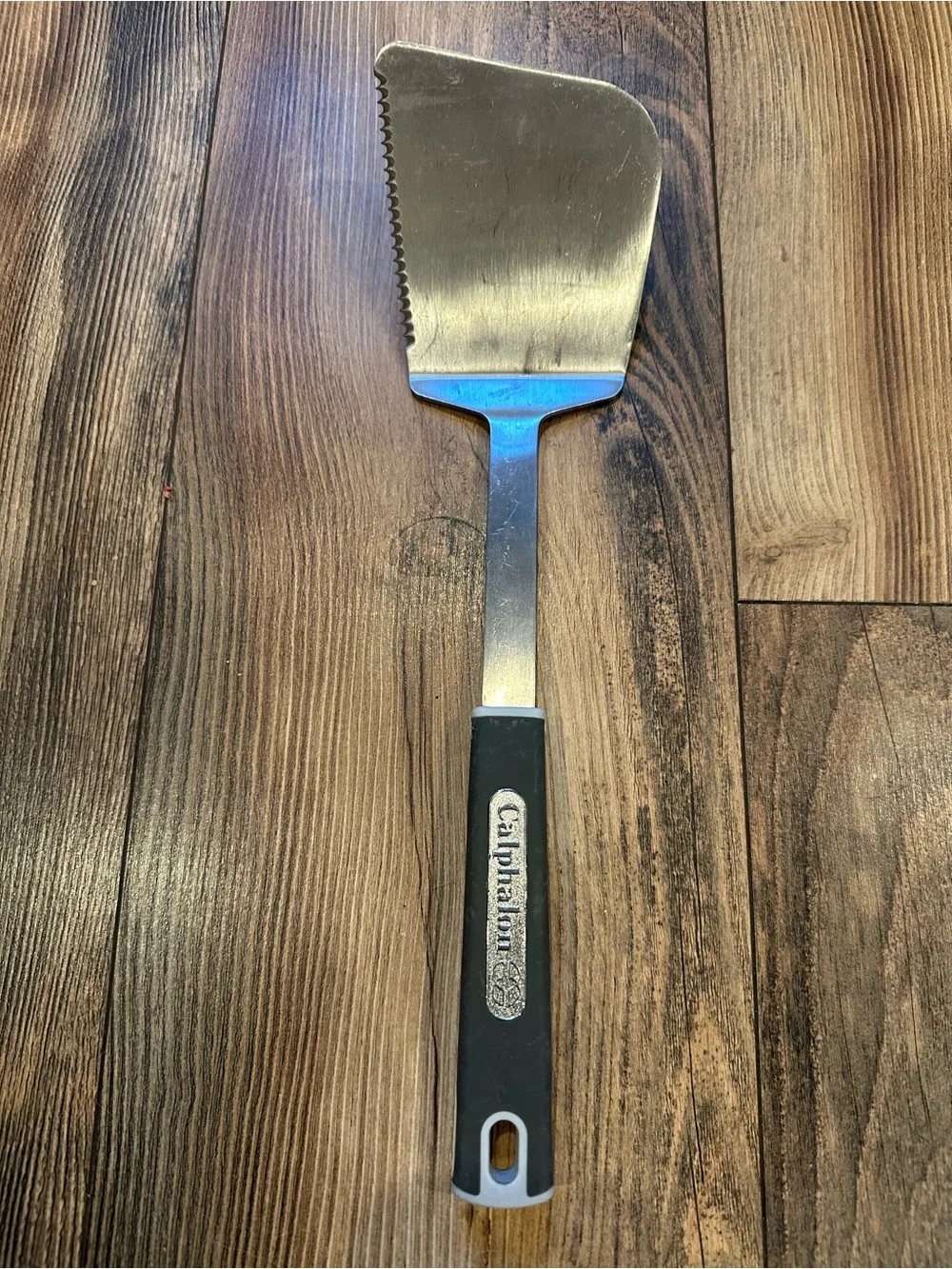 Calphalon Stainless Serrated Turner with Black Handle Kitchen Utensil